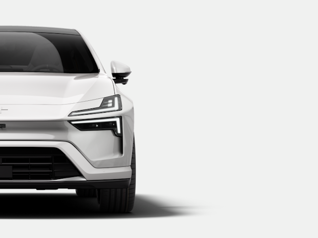 Front view of a white Polestar car with visible headlights and grille on a white background.